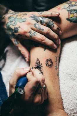 tattoo artist tattooing